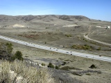 Transgressive lower and regressive upper Cretaceous sequences at Dinosaur Ridge (foreground) and the base of Green Mountain (distance) record the wash in and drain off of the Cretaceous Interior Seaway