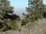 Denver from Genesee Mountain; 1.7 Ga metavolcanic gneiss in foreground