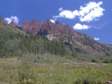 Contorted Triassic redbeds form the north wall of Maroon Creek Canyon near Crater Lake, Elk Range.