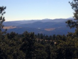 Eocene erosional surface sloping east below Pikes Peak, from Genesee Mountain, visible light