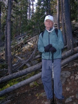John next to downed trees in the avalanche scar.